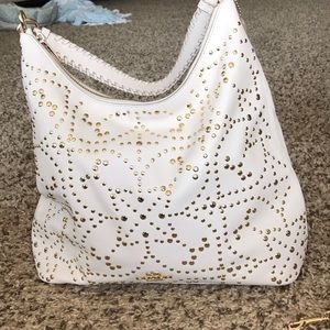 White and gold coach bag